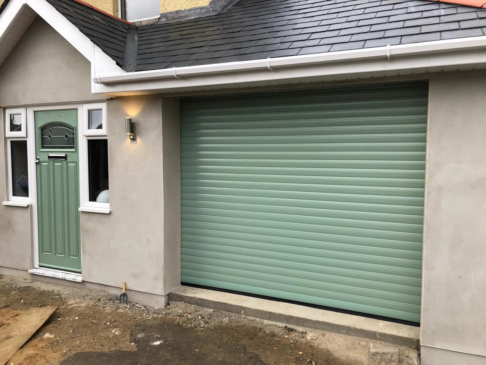 Chartwell green garage door and matching front door