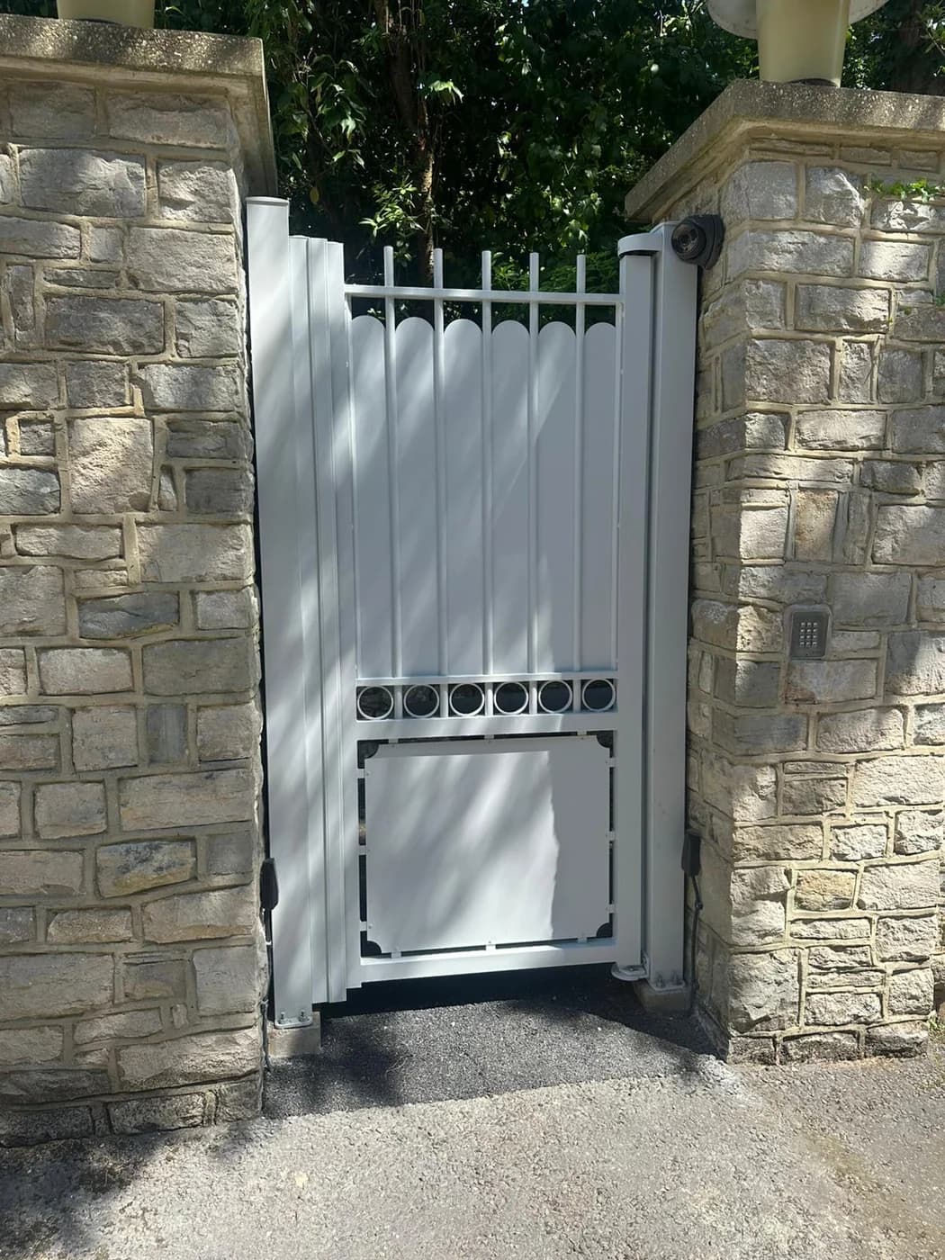 White pedestrian gate with access control keypad